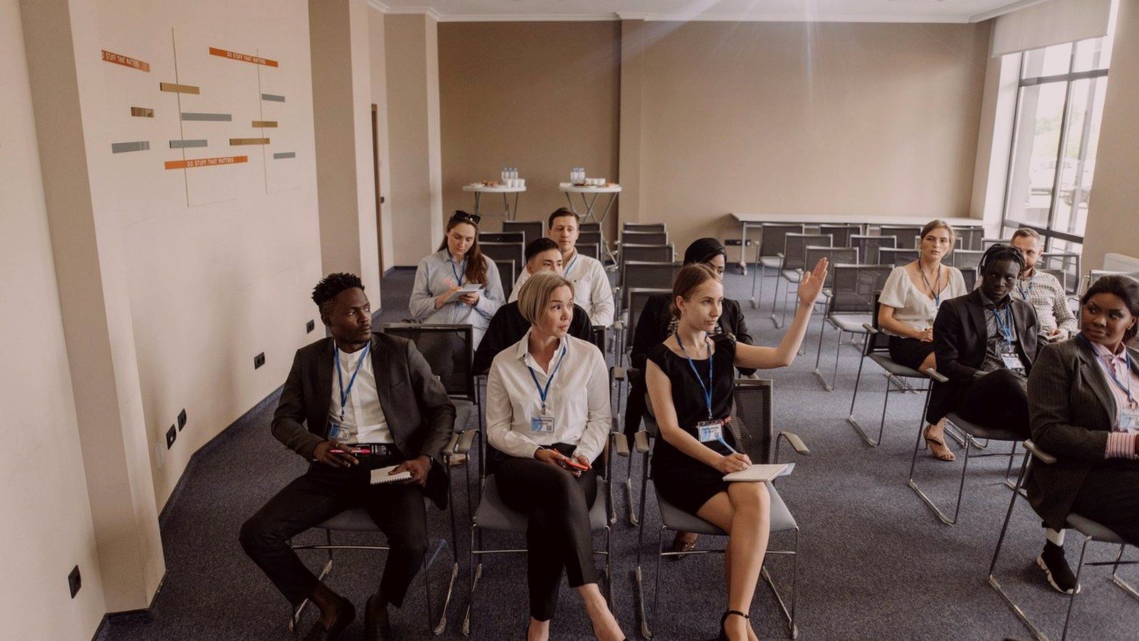 Professional people discussing event venue requirements